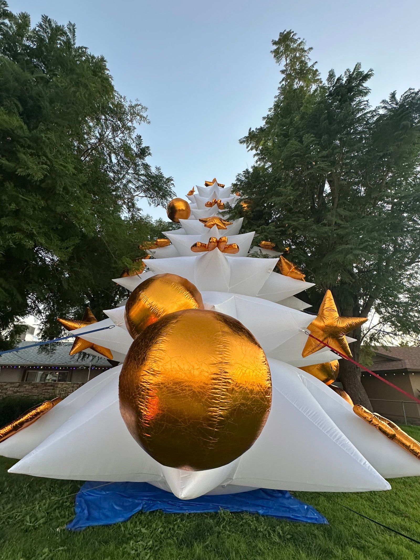 25-foot white Christmas tree advertising inflatable decorated with gold ornaments