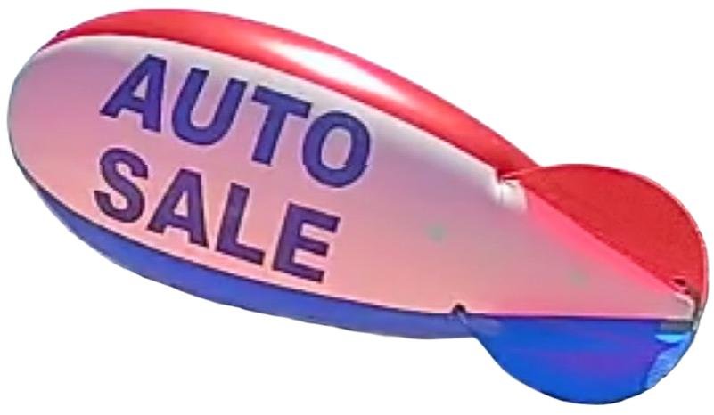 Red white and blue Auto Sale helium advertising blimp for a Texas automobile dealership promotion